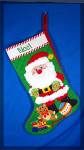 Very nice Christmas stocking. Santa surrounded by toys and NOEL cross stitched on the top.