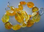 Citrine Faceted Beads with tiny Bead spacers Sterling Silver Toggle Clasp and Hearts either end of the Toggle Bar. The largest bead is 1 1/8 inches and it is 17 3/4 inches end to end very possibly Vin...