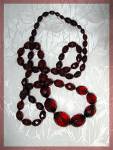 <BR><BR>Fabulous Opera length Cherry Amber Faceted Necklace ith a hidden twist clasp. the actual length of the necklace is 33 inches and the  beads are Graduated from 3/8 of an inch to 7/8 of an inch....