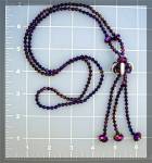 <BR><BR>Necklace of Purple  Faceted Crystals and white round ones in this 29 inches long necklace  with a 3 inch Tassle and large Round Crystals.<BR><BR><BR>