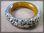 Beautiful Hand Crafted Bangle bracelet from Nepal. The Bangle was made By Nepalese Artists in their homes. The Inside of the bangle is Gold Bakelite with Silver Laid over the top. There are Animals Bi...