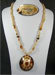 Miriam Haskell Mother of Perl Shell and Glass Necklace. The necklace is 28 inches and the Shell Pendant is 2 3/4 inches long and 2 1/2 inches wide with no chips. The is Pat 3427691 in the long gold co...
