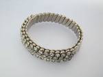 Silver tone Expanda Bracelet 3/8 of an inch with Sparkling Crystals half way round the Bracelet.