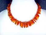 Baltic Amber Graduated Necklace 17 Inches 1 1/8 inch Center Bead twist clasp is  Amber.