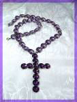 Amethyst Glass Claw Set necklace that is 22 inches with a 3 inch x 2 1/8 inch Cross on it. the necklace is Fabulous and each of the Stones is Brilliant. The Amethystas on the Cross are Slightly Darker...