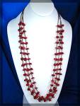 Beautiful Red Coral Nuggets and Tan heishi beads 3 Strand necklace with Sterling Silver Points and a hook Clasp. the necklace is 28 Inches long.