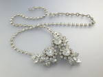 50s Rhodium Silver 18 Inch Crystal Flowers Necklace Austria. Crystals are ll along the necklace with 3 Flower central drop hook clasp.