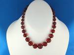 Cherry Amber Faceted and Graduated Bead Necklace 14 1/2 inches with a Spring Ring Clasp. The Center Bead is 15mm and the smallest is 7.5mm. The Beads are Hand knotted and can be made longer with an ex...