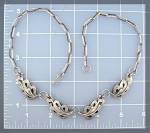 Sterling Silver Hand made Necklace with 4 Leaf Pannels on it. The Chain is all hand made, and none of the pieces are Signed or marked. there is a hook clasp, and the necklace is 18 1/2 inches. 