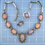Sterling Silver and pink/Green opal Art Glass Necklace from Taxo mexico. The necklace is 19 inches end to end, and the center pendant is 1 1/2 inches. The color of the Opals are outstanding with varyi...