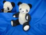 Fully jointed stuffed panda bear. He stands 10 inches tall with white paws. No makers tag or growler. 