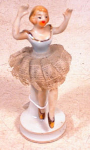 Lovely Made in Japan Ballerina figurine with extended arms and uplifted leg.   Her stiff, real lace tutu is in quite good condition..no breaks.  Gold slippers and bodice trim highlight this pretty lad...