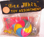 Never opened package of 6 vintage tin toys with great colors.  Bag contains 2 puzzles, a crocodile clicker, a multi colored top, a tiny spinner with litho of bugs and flowers, and another clicker in t...