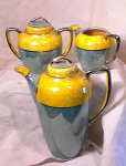 Beautifully colored, hand painted vintage demitasse/coffee serving set consisting of the covered pot, covered sugar, and creamer (which was not made with a lid), all pieces in absolutely great conditi...
