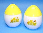 This is a set of Avon salt and pepper shakers. They are egg shaped, the bottom is milk glass with a daisy, yellow flowers and a butterfly on the front, and the top is made of yellow plastic. They are ...