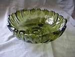 Wonderful green bowl that would look great on any table with fruit in it.  This bowl is from Anchor Hocking and is 12" in diameter and 3 3/4" tall.  The 3 feet give the bowl a different look...