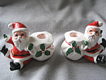 Terrific old santa candle holder made in Japan.  Santa's sack is the candle holder.  Candle holders are 3" tall.  Some paint off on one candle holder (see picture), but other candle holder is in ...
