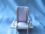 Cutest little pin cushion in the shape of a rocking chair.  Chair is 5 1/2" X 4 1/2" and has a place to put spools of thread on each side.  The pink and white checkered seat/cushion is a lit...