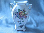 Wonderful vase with double handles and decorated with flower design.  Vase is 6" tall and has "Made in Japan" on the bottom.  In excellent condition.