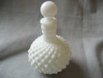 Not really sure if this is Fenton, but sure does look like it.  Wonderful milk glass barber bottle in the hob nail style.  Bottle is 7" tall.  Top does not have the cork but otherwise both top an...