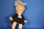 Cute little plastic doll with black dress and the blonde hair up on top of her head.  Doll is 8" tall and has moveable parts.  Has "Jolly's Toys, 1972" ont he back of her neck.  In exce...