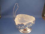 Wonderful milk glass candy dish in a silver metal rose case with handle.  All in excellent Condition.
