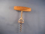 Great old wooden handle cork screw with advertisement on the handle.  Can not make out what it says, but made out it was made by Walker.  In excellent condition.