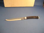 Still in the original box, these great stainless steel knives were made in Japan.  Handles are plastic, but made to look like horn.  In excellent condition.