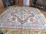 Colorful table cloth made from silk threads from Italy.  Great flower designs and each corner has an angel riding a horse.  Table cloth is 32" square without the fringe.  Has never been used, sti...