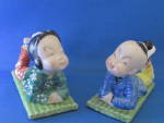 Very hard to find, these great oriental figurines are in excellent condition. Each figure is lounging on a rug.  Figurines are 3 1/2" X 3".  Has "Made in Occupied Japan" on the bot...