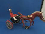 Wonderful horse and buggy racer toy made in Germany.  Horse's legs move when pushed.  Has "Made in Germany" on the bottom.  Is missing the reins, but otherwise in excellent condition. Toy is...