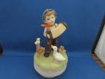 This cute music box if designed to look like the famous Hummel figurines, but were sold at Woolworths years ago.  Cute boy playing the accordion and duck is listening or singing along.  Music is the t...