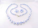 This is a long vintage necklace and matching screw back earrings.  The necklace is not marked but the earrings are signed JAPAN.  The set is made of white glass beads with blue polka dots.  The neckla...
