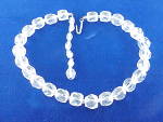 This is a vintage choker necklace made of cut crystal glass beads.  The necklace is signed JAPAN.  It is adjustable and measures from 13 to 15-1/2 inches long.  It is 3/8 of an inch wide.  There are t...