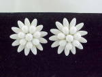 This is a pair of vintage clip earrings.  They are not signed.  The earrings are shaped like large flowers made of white milk glass beads.  The earrings measure 1-3/8 inches in diameter.  They are in ...