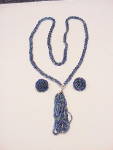This is a vintage twisted seed bead necklace and clip earrings.  The earrings are signed Japan.  The set is made of tiny glass seed beads in various shades of blue.  The necklace has three strands of ...