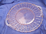 This Pink 2 Handled Sandwich Tray is in the Sierra Depression Glass Design that was produced by Jeannette Glass from 1931-33. This Pinwheel styled platter measures 10" in diameter (not including ...