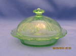 This Green Cherry Blossom Covered Butter Dish is in the Cherry Blossom pattern was made by the Jeannette Glass Co., from 1930-39. It measures 6 inches in diameter and 4 inches tall with the lid on. Th...