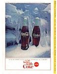 This ad was taken from the National Geographic Magazine July 1964. It features  two Coca Cola Bottles in Ice. This ad is in good condition considering its age. 