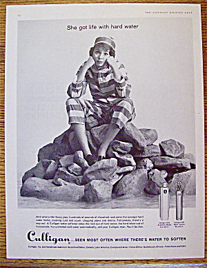 1961 Culligan With Woman Sitting On Rocks.