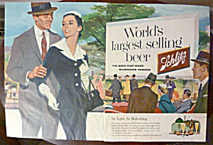 1956 Schlitz Beer With Man & Woman Walking Together