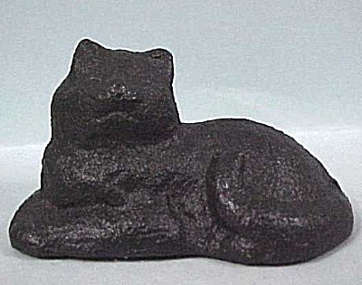 Old Cast Iron Lying Cat