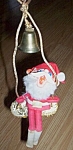 Vintage Rubber Santa on a Swing
