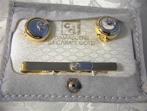 Goldtone Tie Clip & Button Covers.