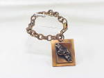 VINTAGE COPPER BRACELET WITH DRAMA COMEDY AND TRAGEDY MASKS CHARM
