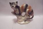 Nice unique Brazilian porcelain cat figurine.  Signed on the bottom.  6-1/2" wide and 6-1/4" tall.  Fine condition with no damage.  1990s.