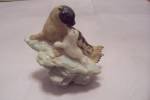 Cute resin/composition figurine of a seal and her pup on a rock.  Has sticker on the bottom.  4" wide.  Fine condition with no damage.  1990s.