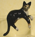 K2291c Black and White Hanging cat, about 1.2" high, new porcelain miniature. 