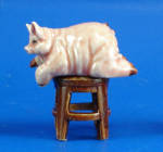 K2081 Fat Pig on Stool, about 1.5" high.  New porcelain miniature. 