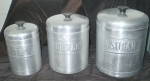 Very Nice Set of Sugar, Coffee, and Tea <BR>Cannisters made of Aluminum. They measure as stated, and will be a charming addition to a Stainless Steel Kitchen. Very Lightweight. Hostess-ware Brand was ...